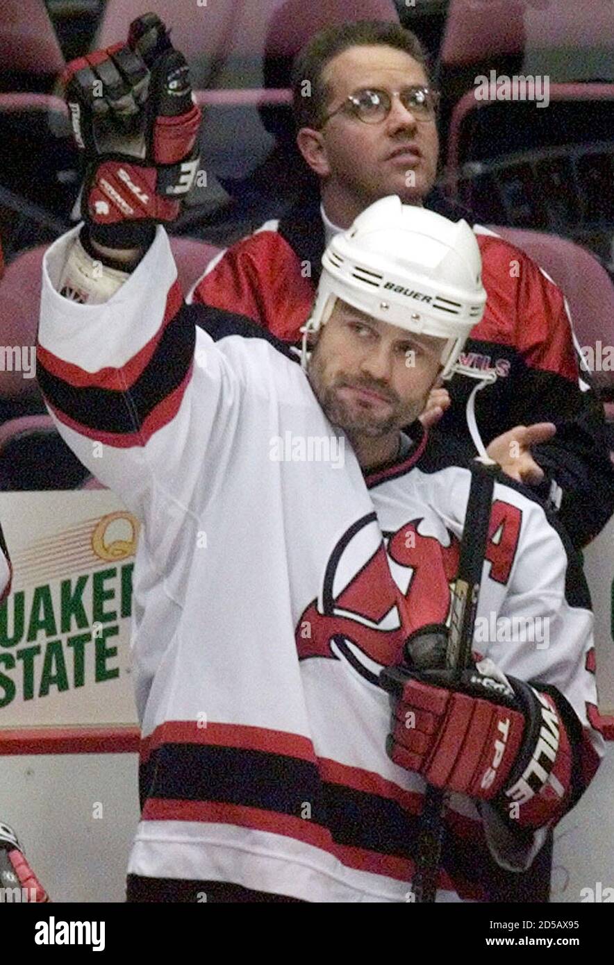 New Jersey Devils' defenseman Ken Daneyko (C) waves to the crowd as he is  announced before the Devils game with the Tampa Bay Lightning January 15 at  the Meadowlands Arena in East