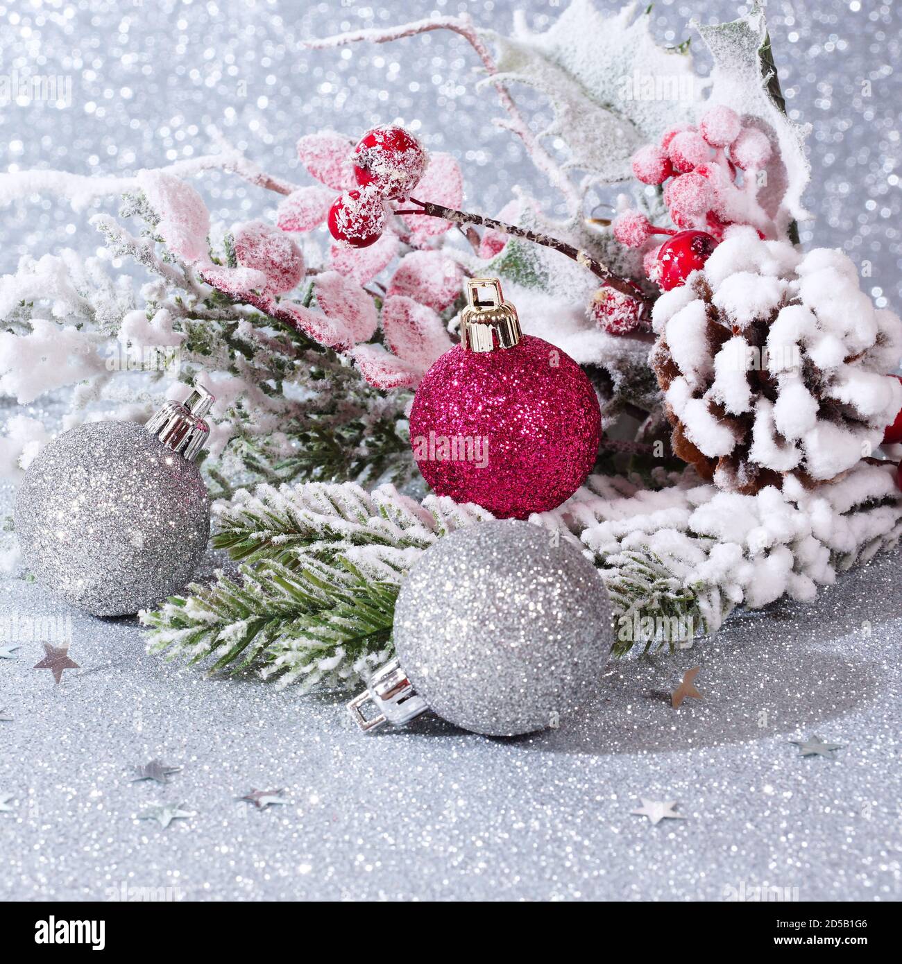 Christmas composition with balls and fir branches on a silver ...