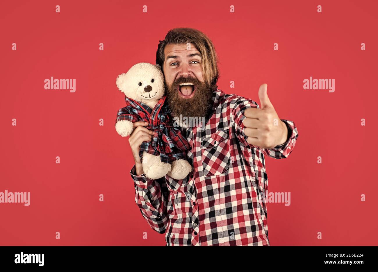 best offer. Man holds teddy bear. Gifts and holidays concept. This is for you. hipster like animal toy. Birthday holiday party celebration. feel happiness. Man with beard hold cute toy bear. Stock Photo