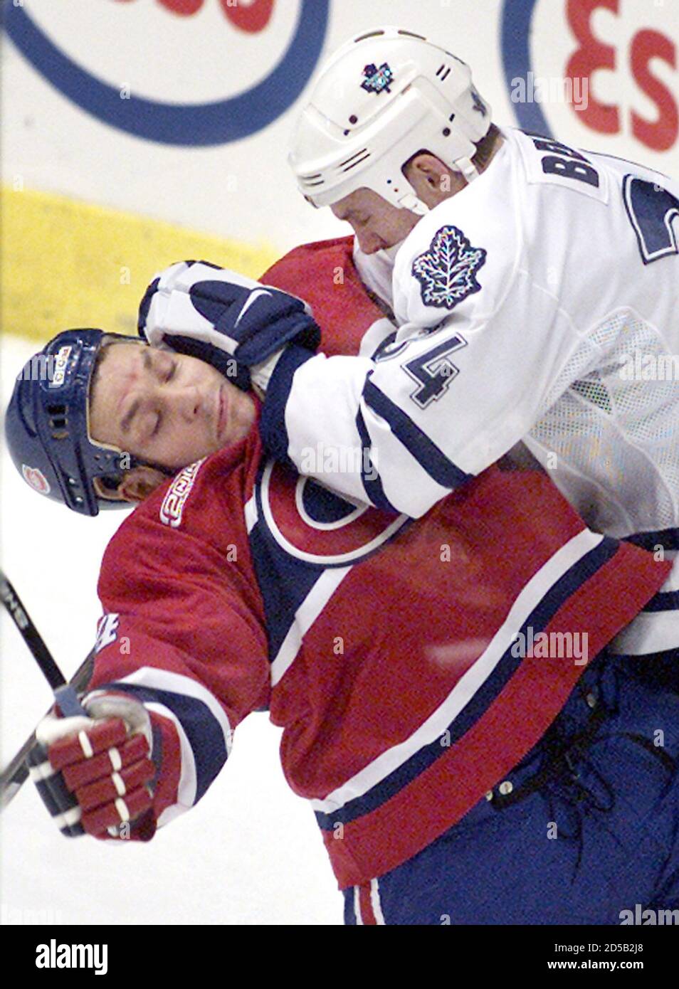 Montreal Canadiens center Scott Thornton (L) gets roughed up in the corner by Toronto Maple Leafs defenseman Bryan Berard during first period National Hockey League action at the Air Canada Centre in Toronto, December 18.  ANW/SV Stock Photo