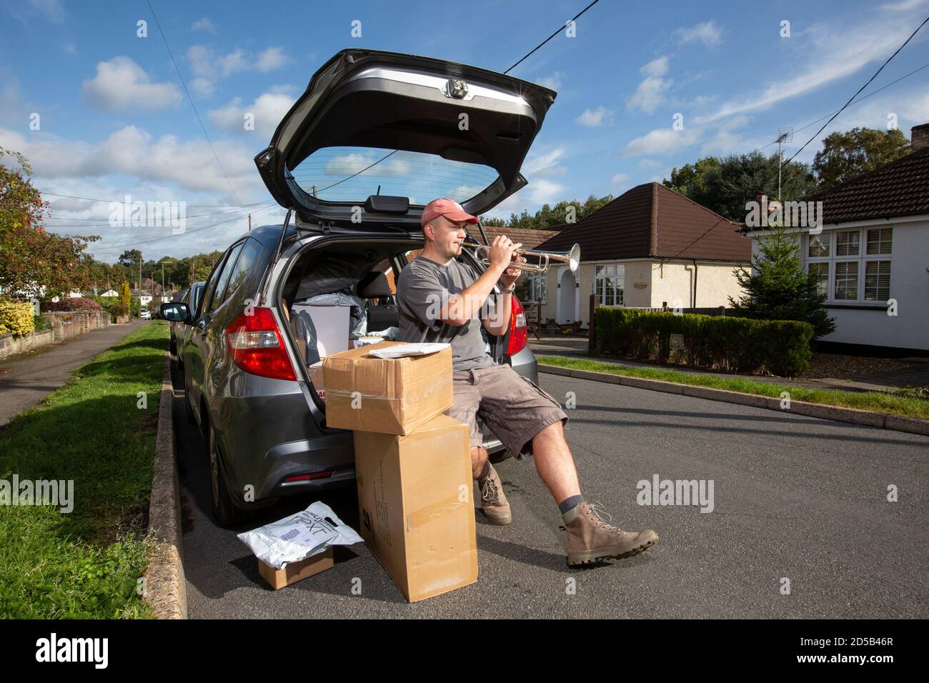 Out of work trumpet player, working as a delivery driver to pay his mortgage due to the coronavirus pandemic closing all theatres and music venues, UK Stock Photo