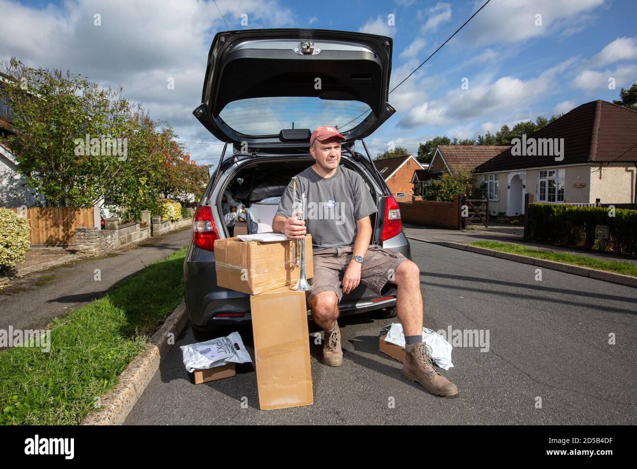 Out of work trumpet player, working as a delivery driver to pay his mortgage due to the coronavirus pandemic closing all theatres and music venues, UK Stock Photo