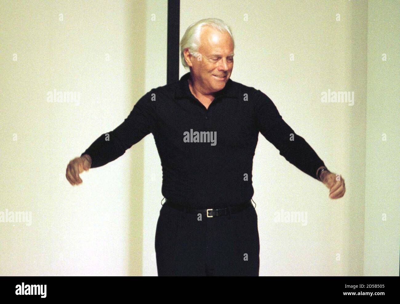 Designer Giorgio Armani appears on the catwalk at the end of his Emporio  Armani men's collection ready-to-wear Autunn/Winter 99 show in Milan  January 12. Fashion week will run until Thursday 15 with