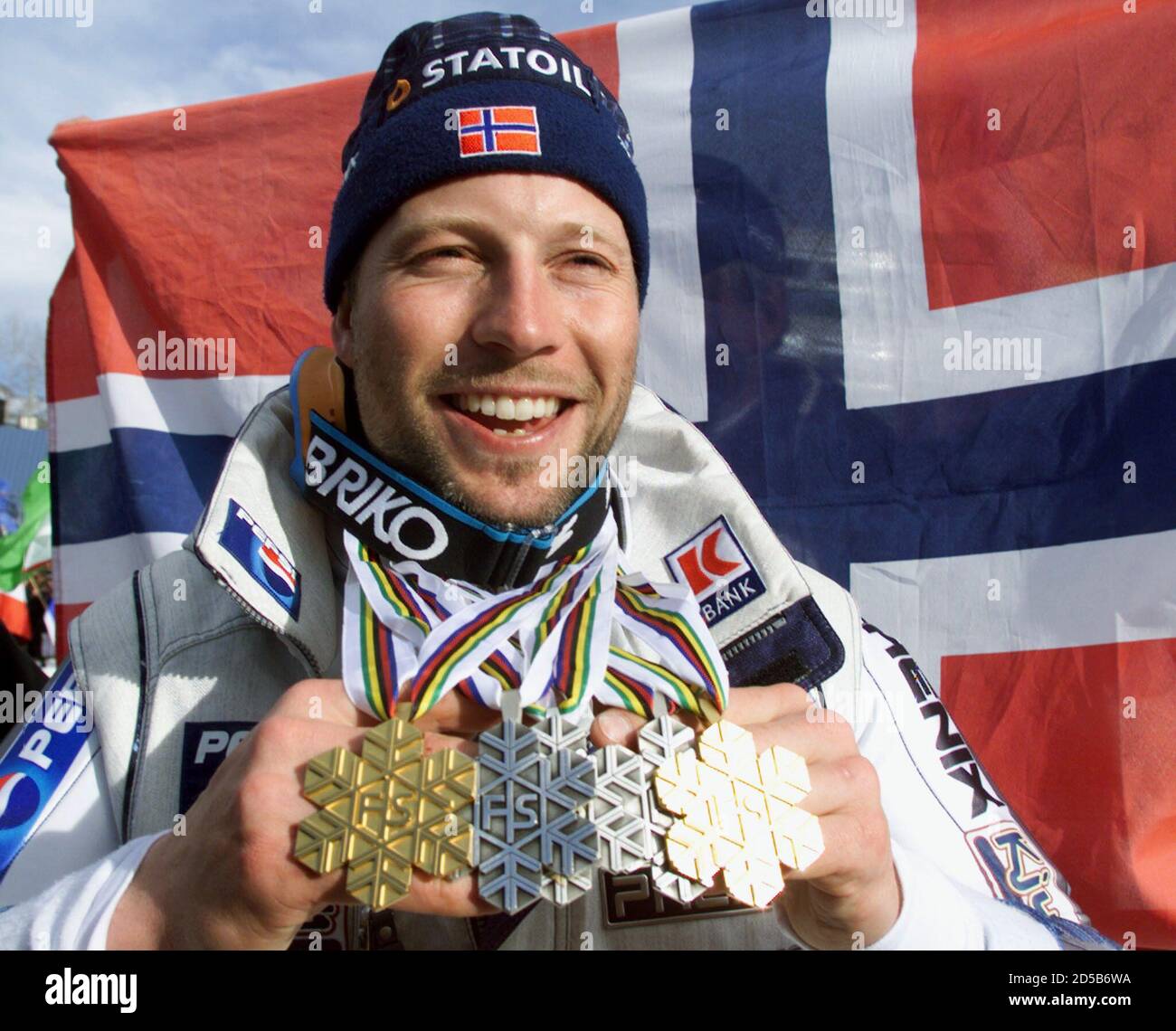 Norway's Lasse Kjus holds up the five medals he won following the men's  slalom race at the World Alpine Skiing Championships February 14. Kjus won  a silver medal in the race, making