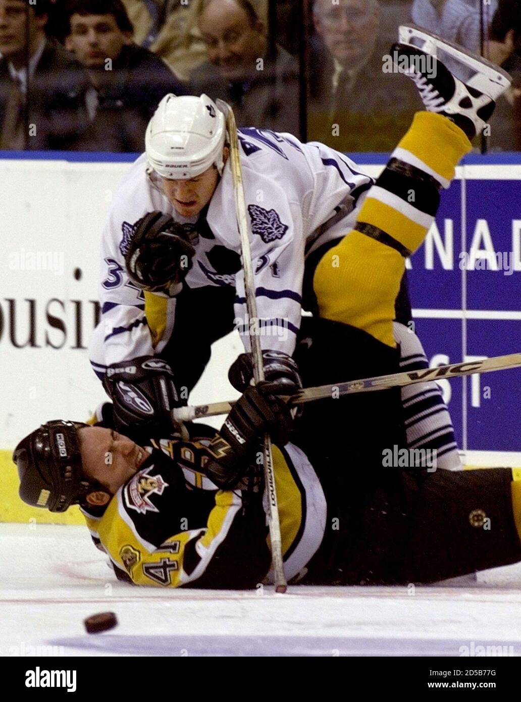 Toronto Maple Leafs Bryan Berard Top Knocks Boston Bruins Jason Allison To The Ice During Second Toronto Maple Leafs Bryan Berard Top Knocks Boston Bruins Jason Allison To The Ice During Second