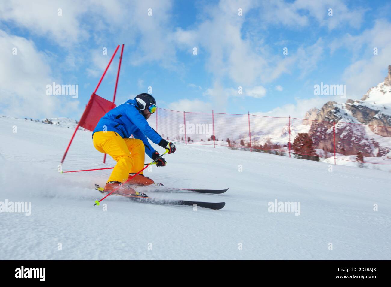 Gs Giant Slalom alpine ski racer skiing down the slope with gates sport winter training at Col Gallina Cortina d'Ampezzo Dolomites Stock Photo