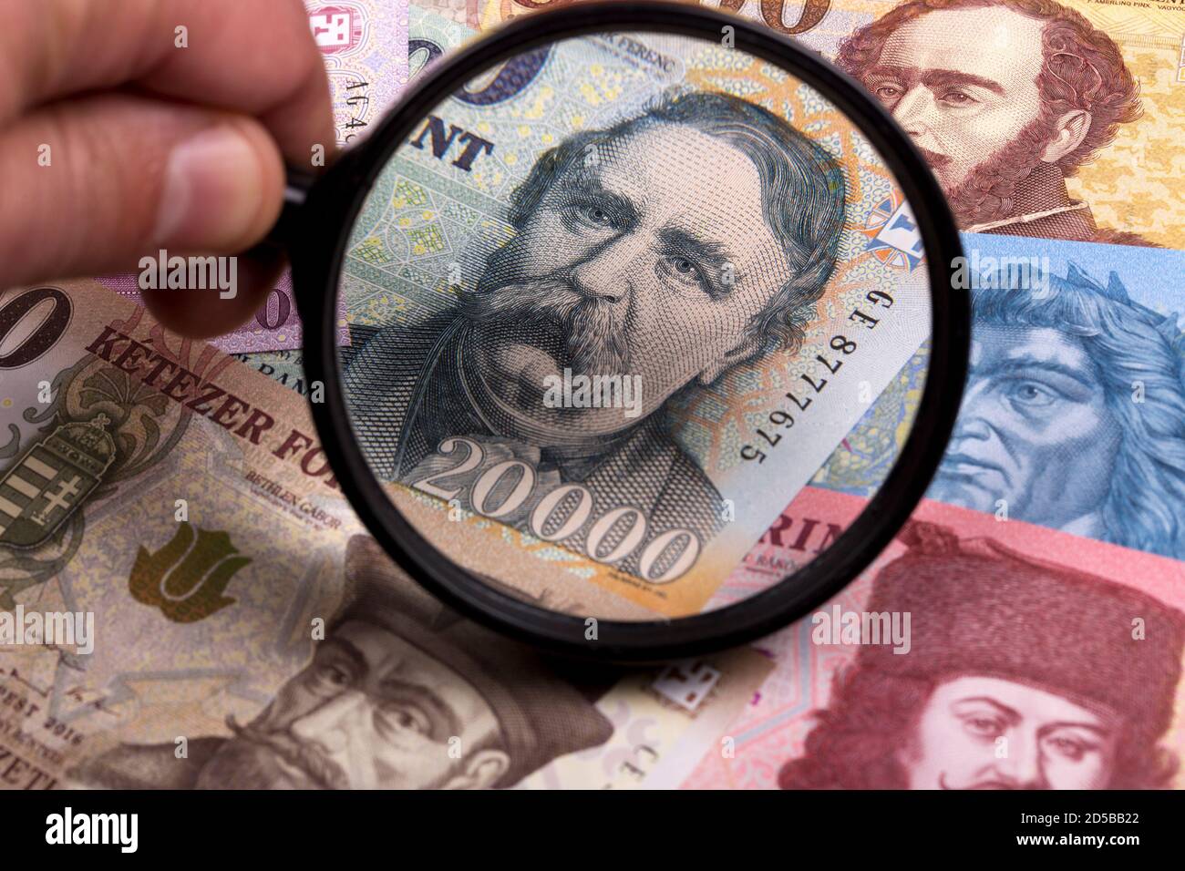 Hungarian forint in a magnifying glass a business background Stock Photo