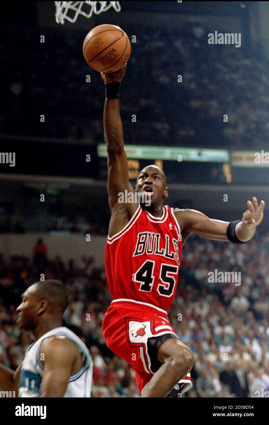 Chicago Bulls guard Michael Jordan goes up for a basket during first round  NBA playoff action April 30 against the Charlotte Hornetts. REUTERS/Gary  Hershorn GMH/CMC Stock Photo - Alamy