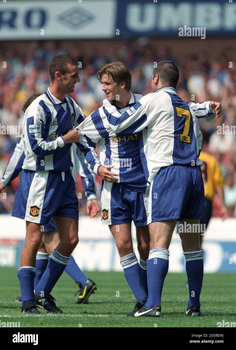 MANCHESTER UNITED'S BECKHAM CELEBRATES GOAL WITH TEAMMATES DURING UMBRO  INTERNATIONAL TOURNAMENT IN NOTTINGHAM. Manchester United's David Beckham  (2L) celebrates his goal with Eric Cantona (R) and another team mate in the  3rd