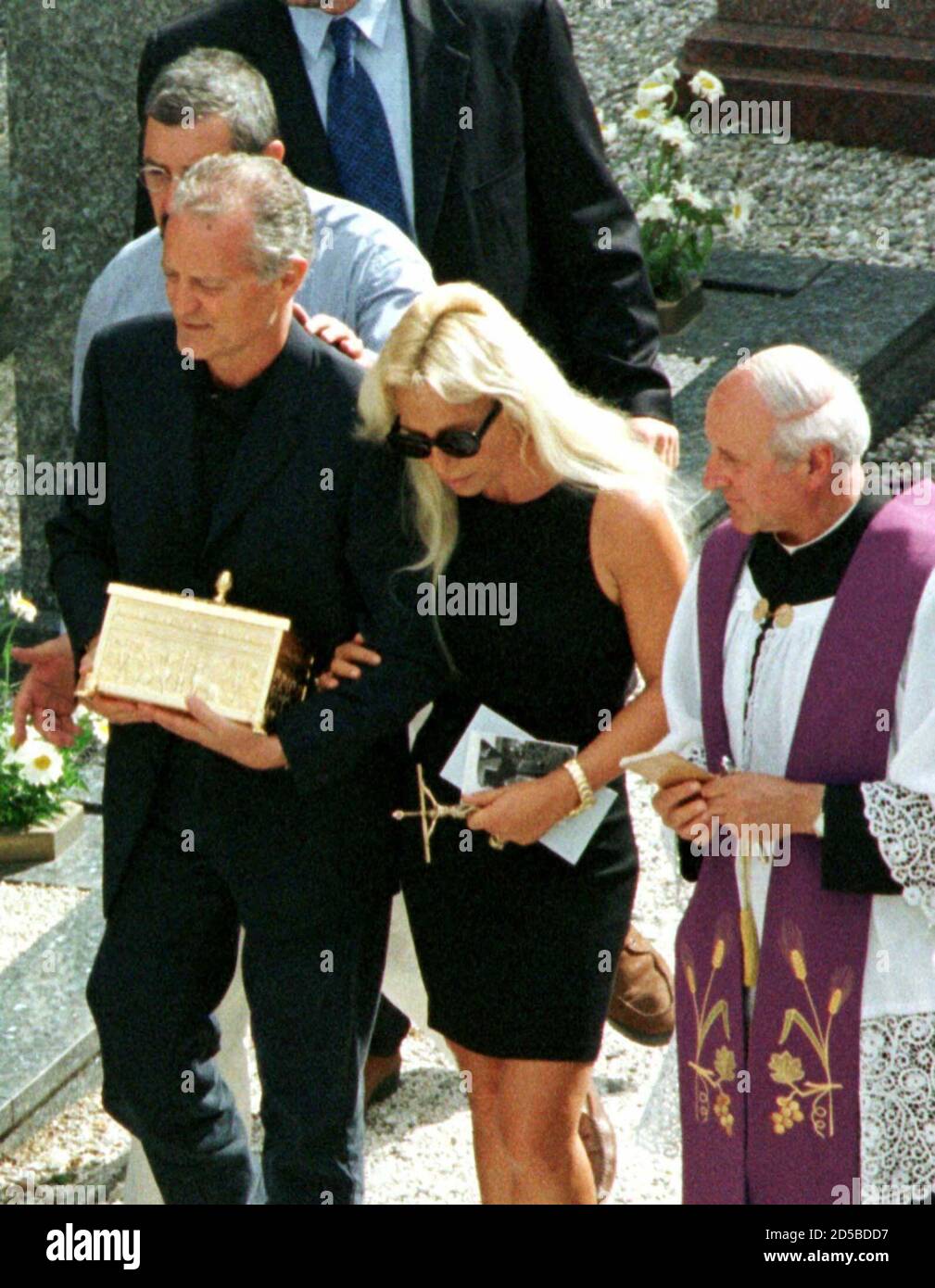 Santo Versace (L), brother of fashion designer Gianni Versace who was  killed outside his Miami home on Tuesday, brings the ashes of Gianni Versace  into the cemetery accompanied by Donatella Versace, sister