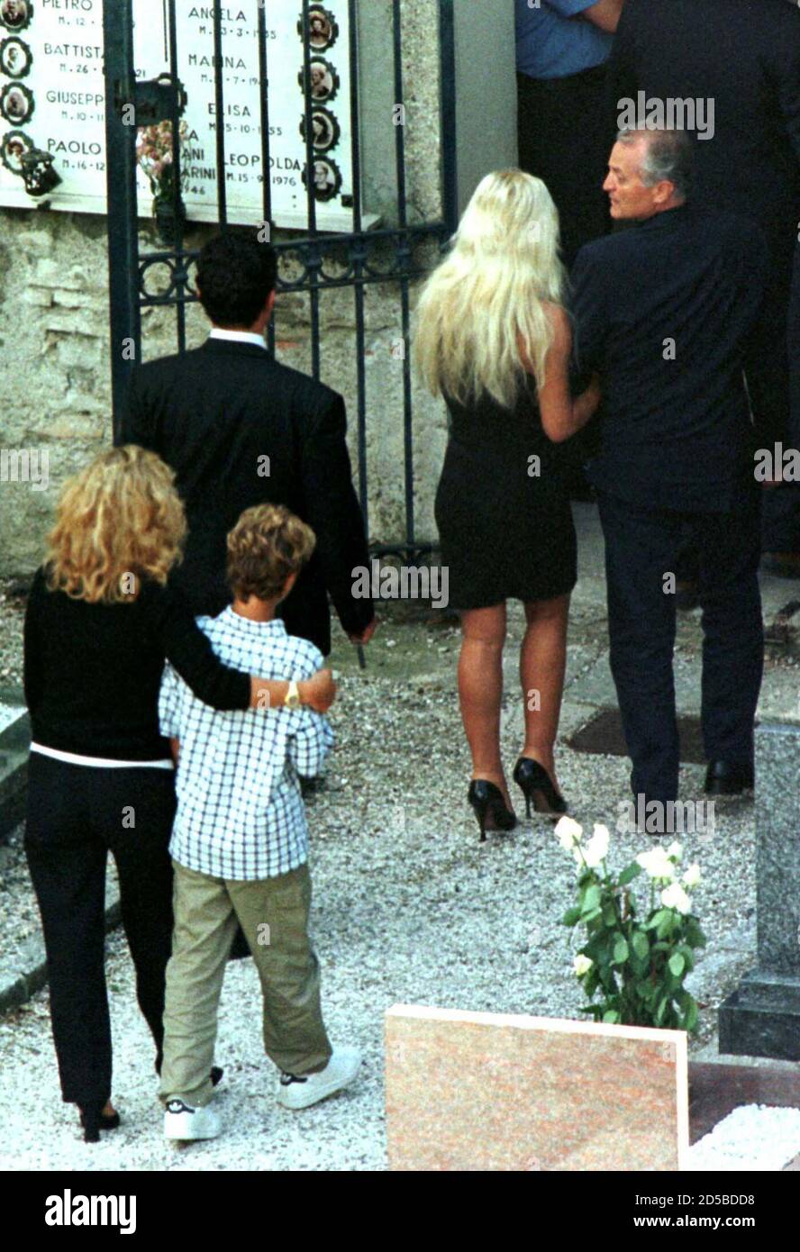Santo Versace (R), brother of fashion designer Gianni Versace who was killed  outside his Miami home on Tuesday, embraces Donatella Versace, sister of  Gianni, at the end of a private ceremony with