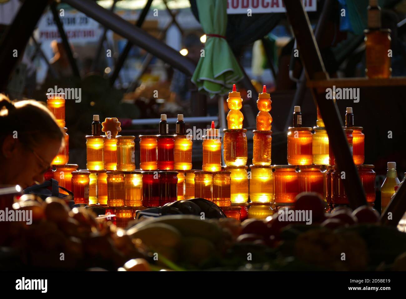 The sun sets over a honey seller's stall in the Transylvanian city of Sibiu, bringing a natural golden glow to the honey. Picture by Adam Alexander Stock Photo