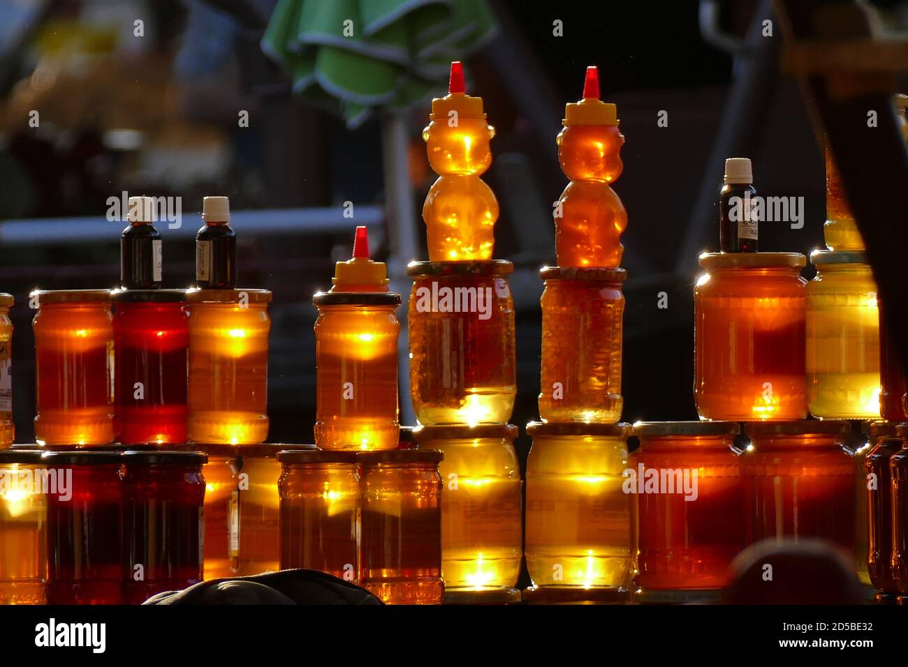 The sun sets over a honey seller's stall in the Transylvanian city of Sibiu, bringing a natural golden glow to the honey. Picture by Adam Alexander Stock Photo