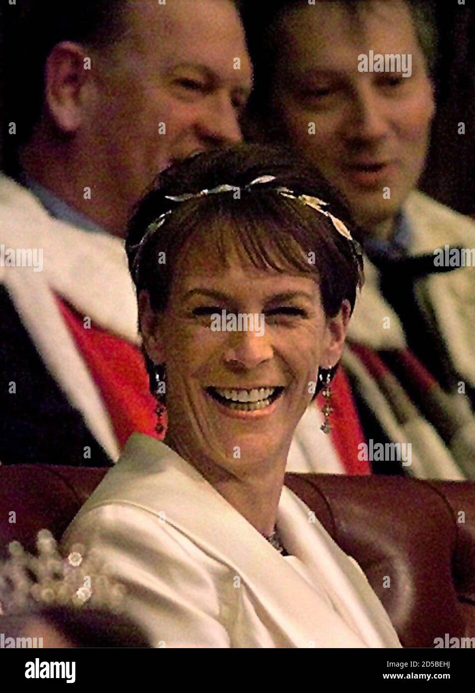 Hollywood actress Jamie Lee Curtis smiles as she sits in the House of Lords  during the State opening of Parliament November 24. The Queen in her  traditional speech read a bill that