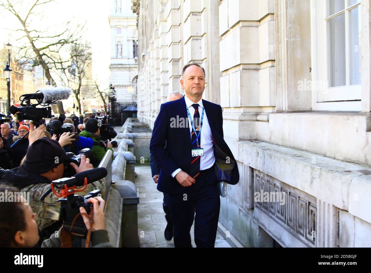 Simon Stevens Chief Executive of the National Health service England in Whitehall , London about to attend a Government  cobra meeting about the COVID 19 pandemic. Stock Photo