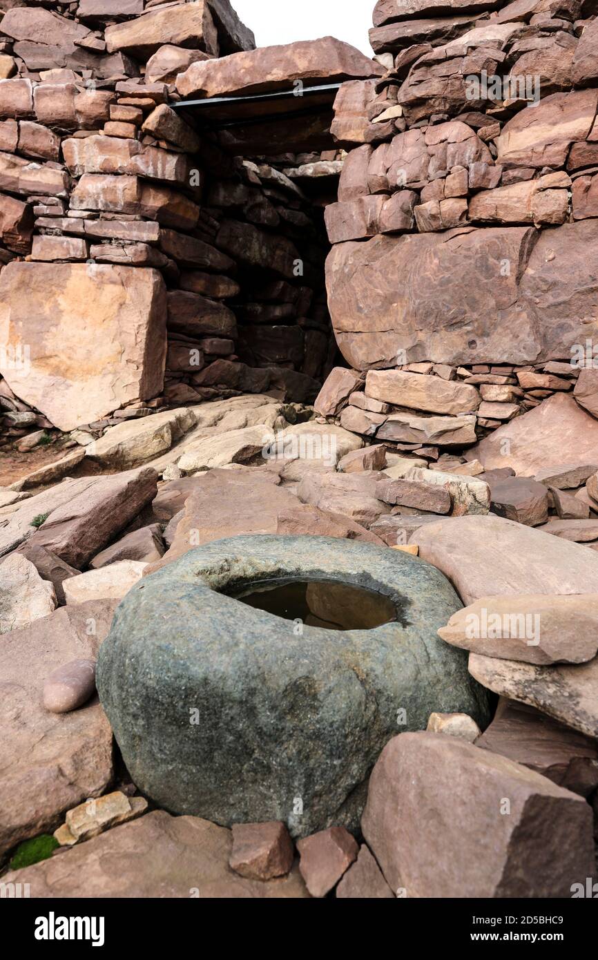 Knocking Stone in the Interior of Clachtoll Broch (An Dun) which is Under Threat from Coastal Erosion and Storm Damage, West Coast of Assynt, NW Highl Stock Photo