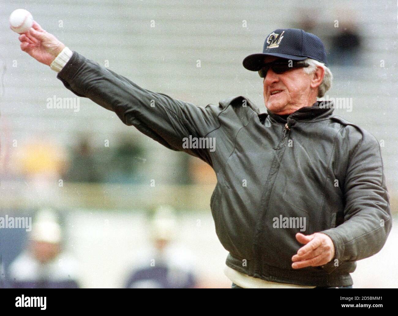 Radio broadcaster and former major league baseball player Bob Uecker throws  out the first pitch before the Milwaukee Brewers home opener against the  Florida Marlins at County Stadium in Milwaukee April 10.