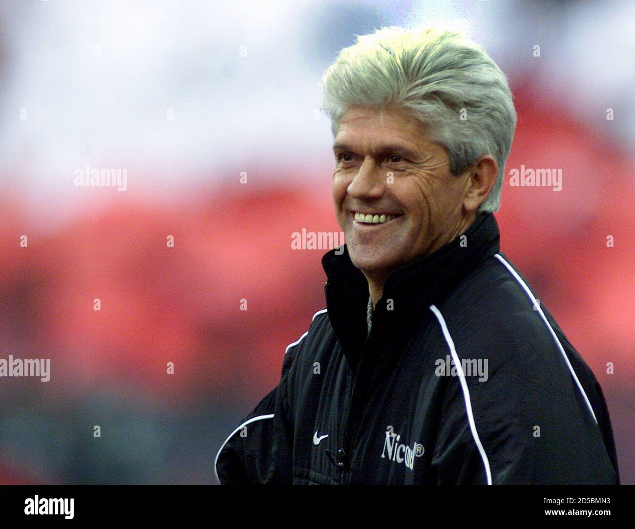 Werner Lorant, coach of TSV 1860 Munich smiles after the German first  division soccer match [against FC Bayern Munich] in Munich's Olympic  stadium, April 15. TSV 1860 Munich won the match 2-1 Stock Photo - Alamy