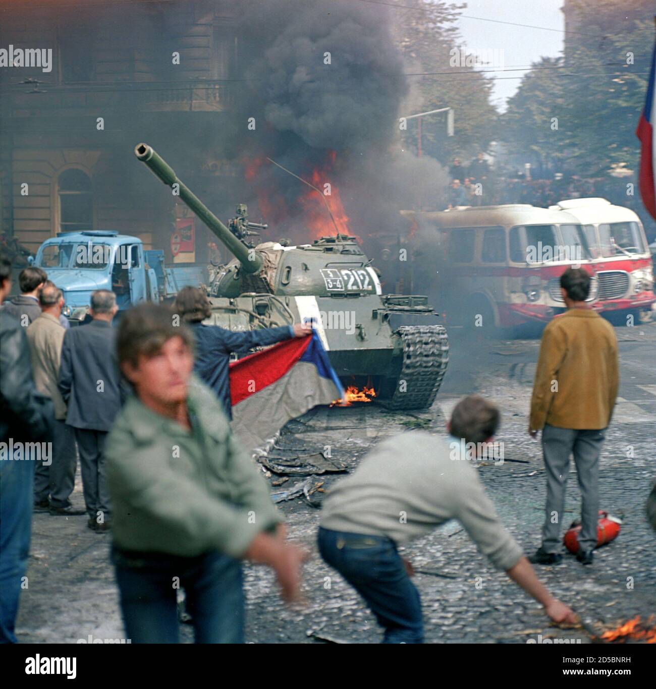 People throw Molotov cocktails and stones at Soviet Army tanks in front of  Czechoslovak Radio station building in central Prague during the first day  of Soviet-led invasion to then Czechoslovakia August 21,