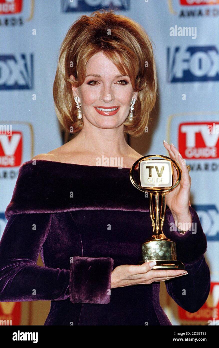 Actress Deidre Hall, one of the cast members of the soap opera ' Days of Our Lives' poses with the TV Guide Award the program won as Favorite Soap Opera at the first annual TV Guide Awards February 1 on the Fox Studio lot in Los Angeles. The awards were determined by readers of TV Guide magazine who voted for their favorite television shows and stars and were telecast live on the FOX TV network. Stock Photo