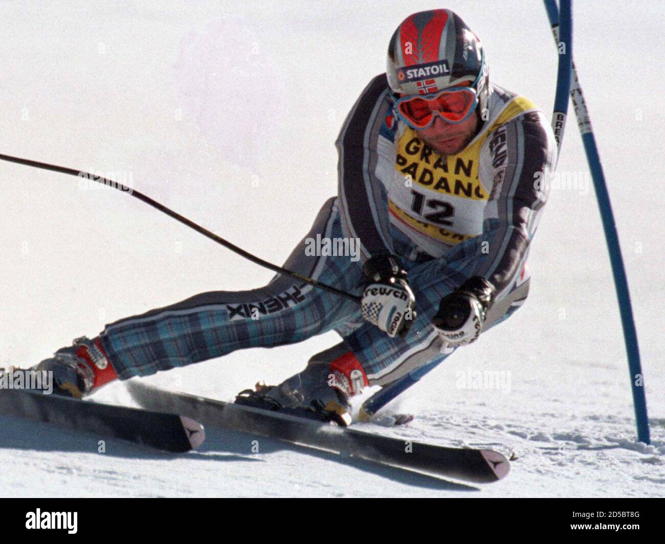 Lasse Kjus of Norway hits a gate on his way to win the gold medal together  with Norway's Lasse Kjus in the men's Super-G race at the Birds of Prey  course of