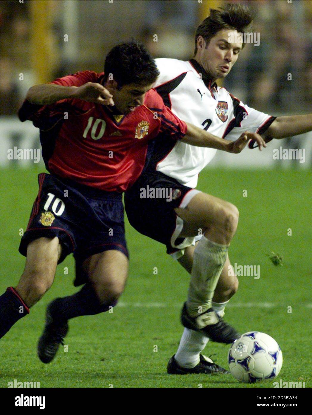 Spanish Raul Gonzalez (L) battles for the ball with Austrian Harald Cerny during their Euro 2000 group six qualifying soccer match in Mestalla stadium March 27. Spain won 9-0 and Raul scored four goals in the match.  SP/CLH/ Stock Photo