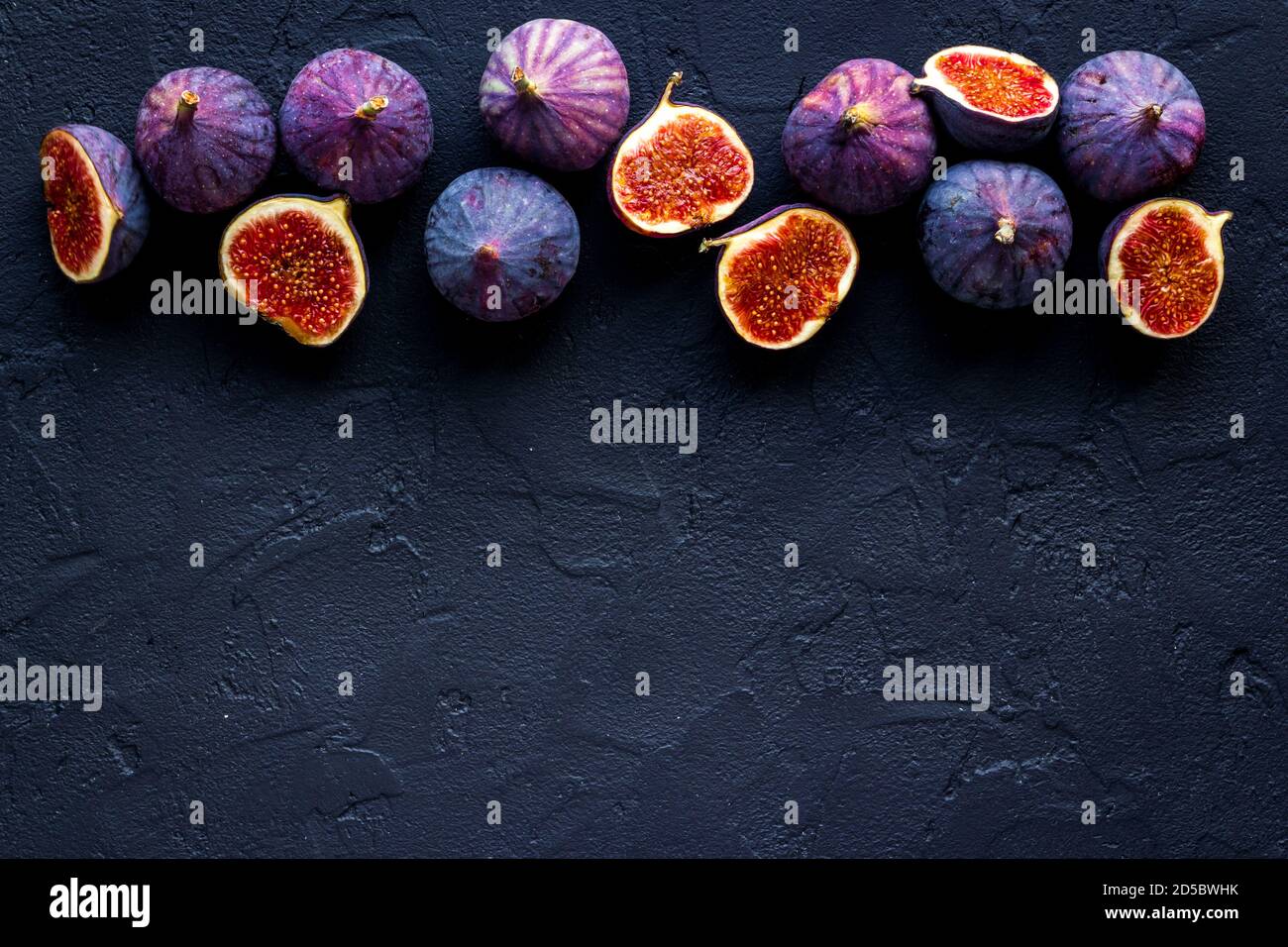 Flat lay of figs on a kitchen table, top view Stock Photo