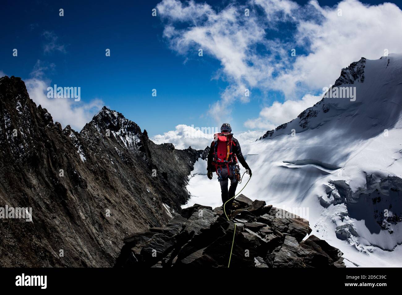 Mountaineer in the swiss alps Stock Photo Alamy