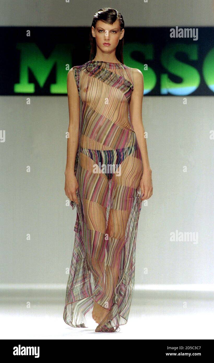 A model wears a semi-transparent dress for Missoni's spring/summer  ready-to-wear collection at Milan's fashion show, October 6. Missoni used  semi-transparent knitted slip dresses for evening and tanktops teamed with  silky black pants.