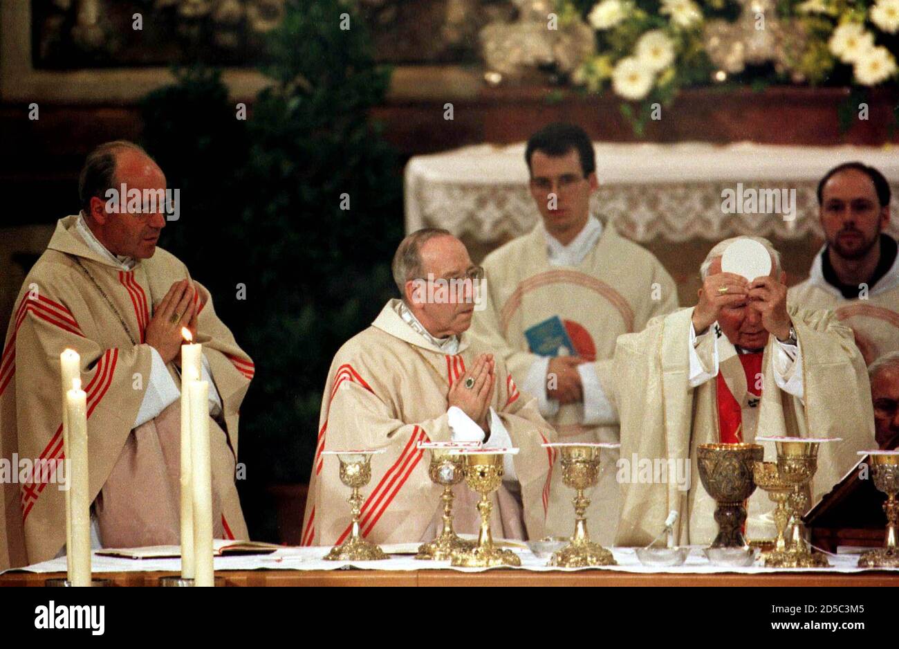 Pope John Paul II (R), Salzburg's Archbishop Georg Eder (C) and Austrian Cardinal Christoph Schoenborn (L) celebrate a holy mass in the Cathedral of Salzburg June 19. The three-day visit to Salzburg, St. Poelten and Vienna is the third by the 78-year-old pontiff to Austria and the 83rd foreign trip in his 20-year reign.  LF/FMS Stock Photo