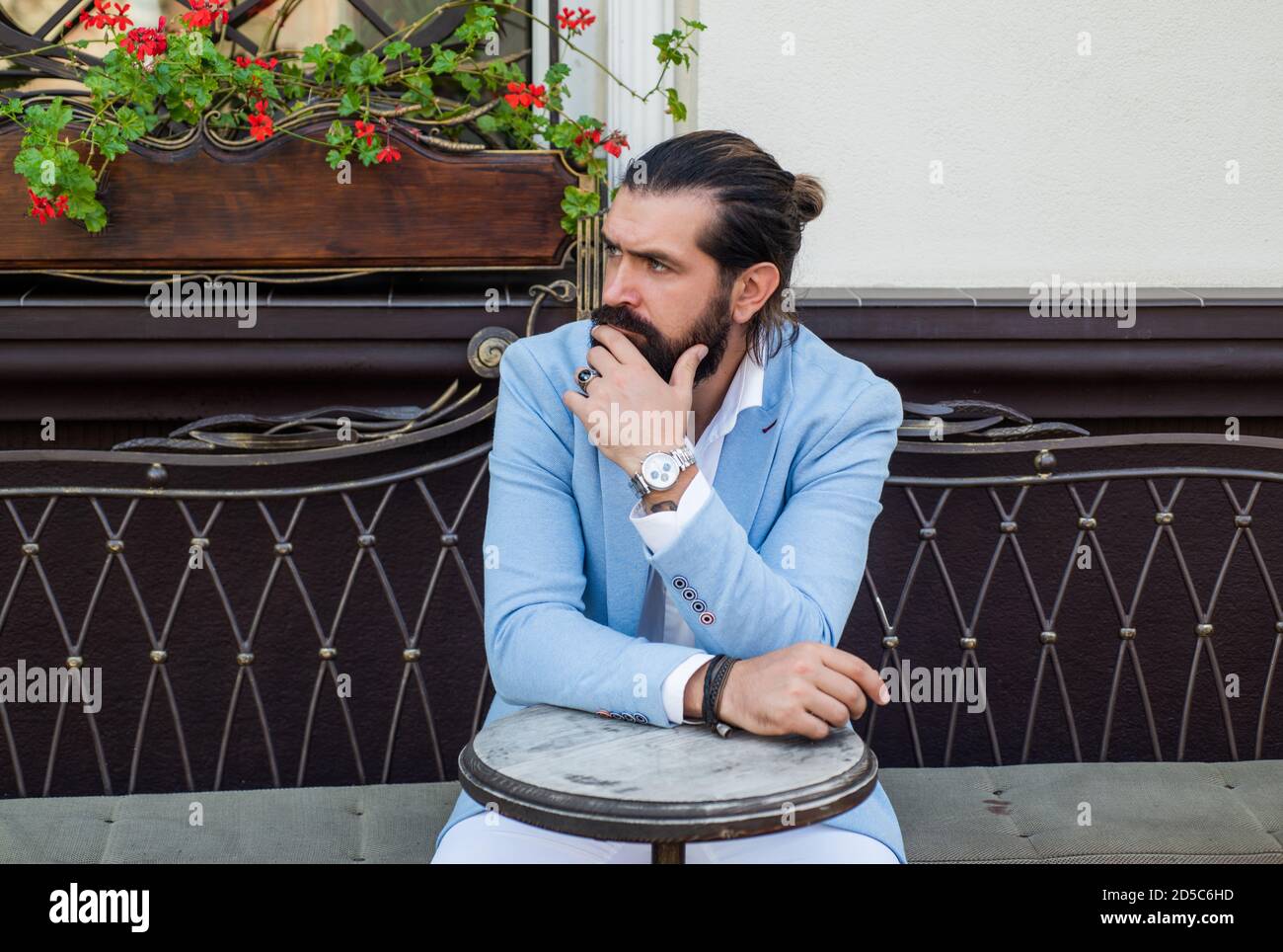 thoughtful brutal guy wear formal business suit in street cafe outdoor ...