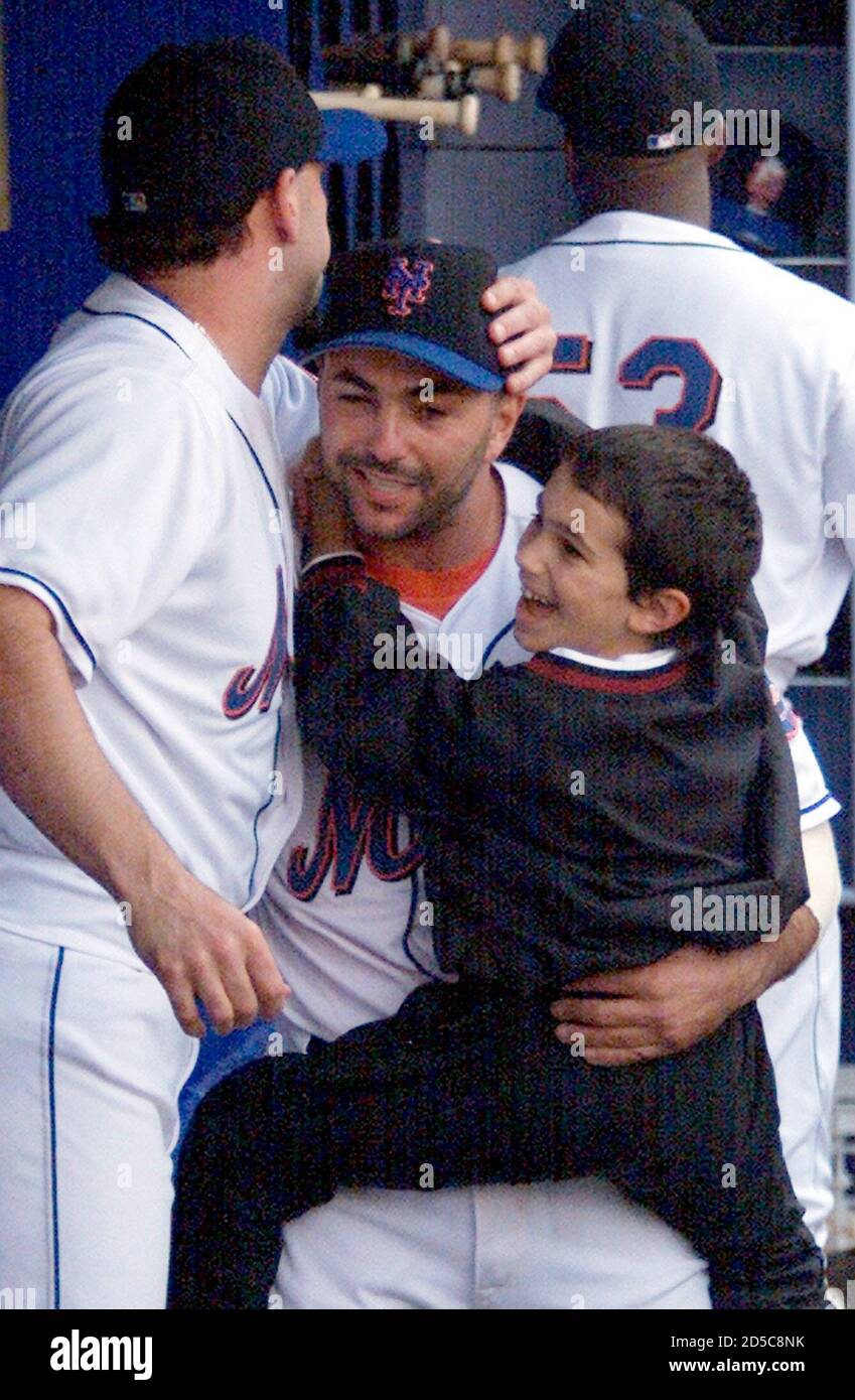 New York Mets Pitcher John Franco Holds His Son And Is Congratulated By Teammate Rick Reed After The Mets Won 2 1 To Give Them A Chance At The National League Wildcard Spot