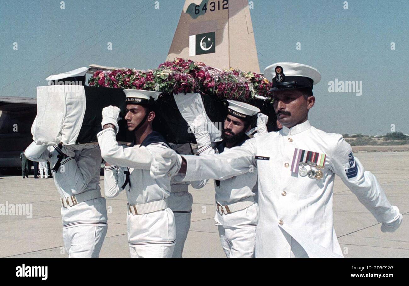 Pakistan Naval staff carry a casket containing the body of their officer  Lt. Commander Kamran Saadat for funeral prayers at Karachi's Mehran base  October 31. A navy statement said on Saturday it