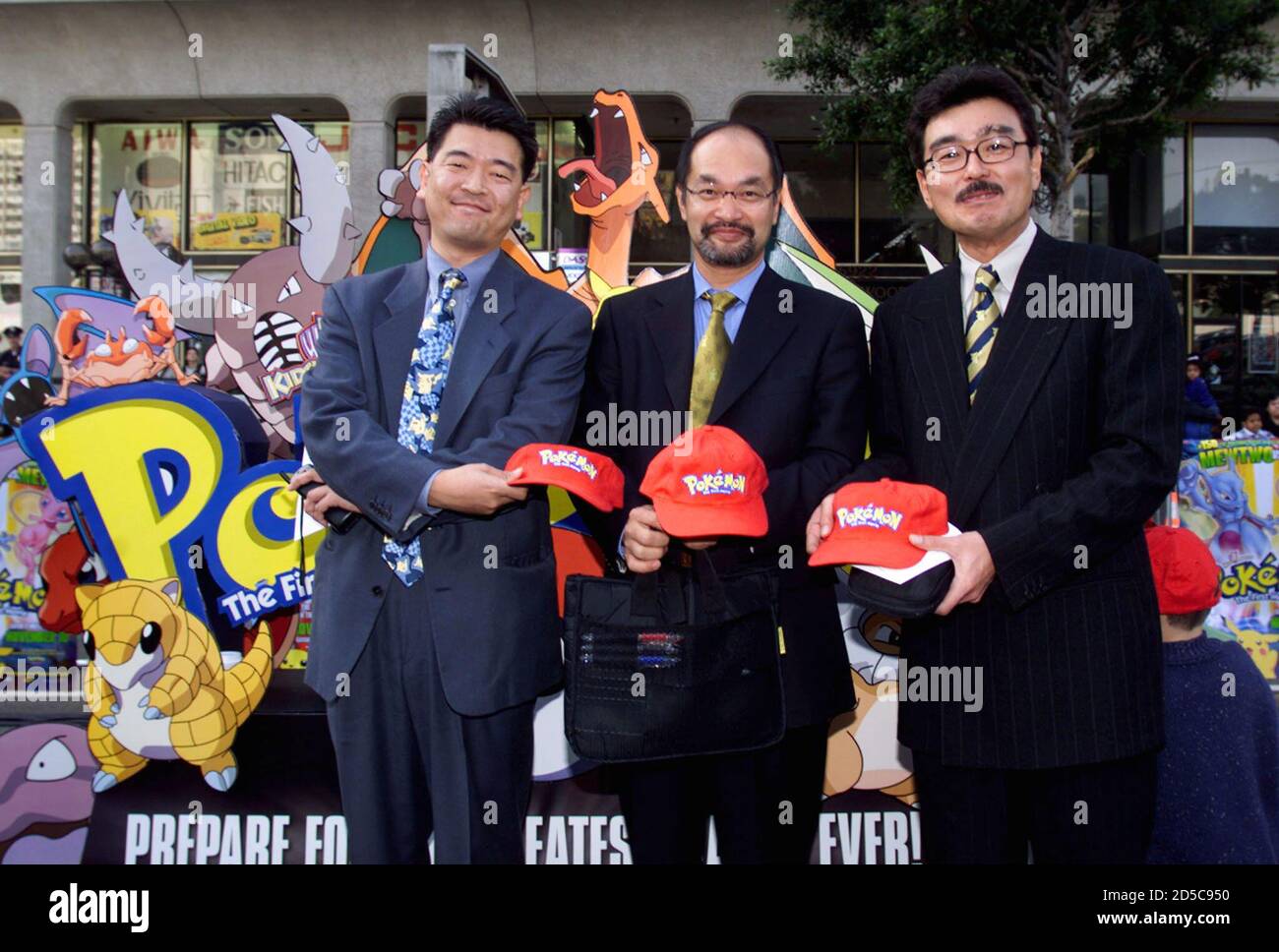 Producers  of the animated film ' Pokemon The First Movie' pose together at the film's premiere November 6, at Mann's Chinese Theatre in Hollywood. From the left are: Takemoto Mori, producer, Masakazu Kubo, executive producer, and Toshiaki Okuno, animation producer. The animated adventure is based on the hit Japanese television series and video game. **DIGITAL IMAGE** Stock Photo