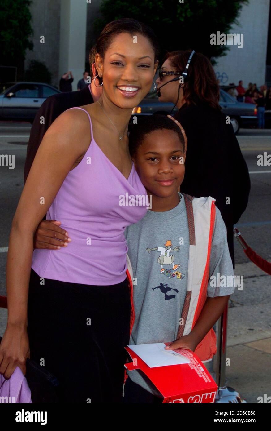 Actress Garcelle Beauvais, who stars in the upcoming film ' Double Take' poses as she arrives with her son Oliver, as guests for the premiere of the new comedy film ' Big Momma's House' starring [Martin Lawrence] May 31 in Hollywood.  [Lawrence portrays a bumbling FBI agent who goes undercover in the film which opens June 2 in the United States. Da Brat is featured on the film's soundtrack.] Stock Photo