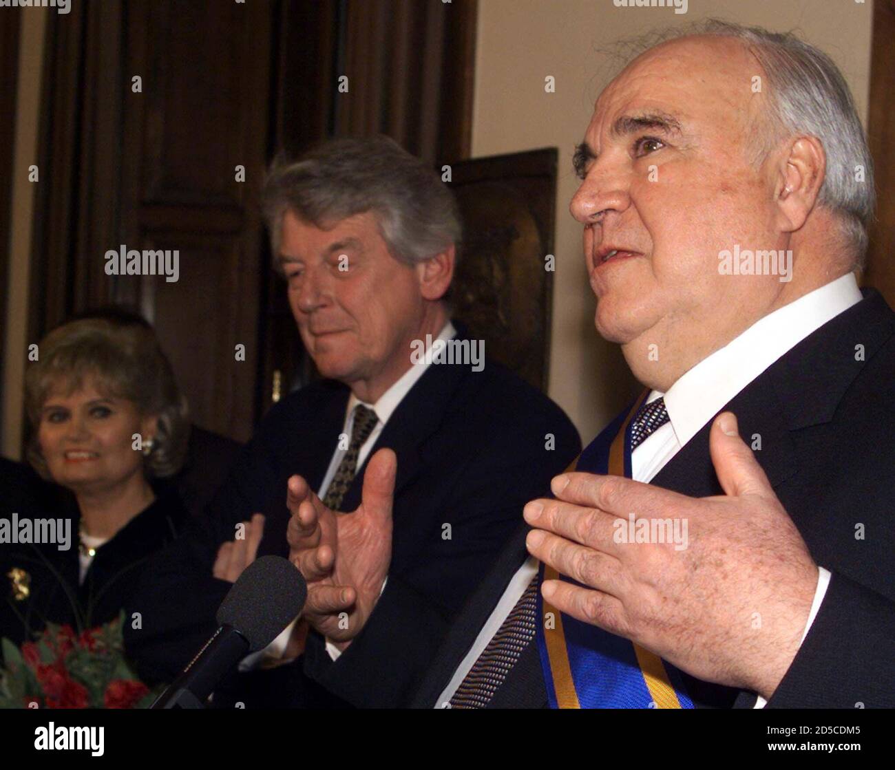 Former German Chancellor Helmut Kohl (R) gestures, while his wife, Hannelore Kohl (L) and Dutch Prime minister Wim Kok listen to his speech in The Hague January 13. During his farewell visit to The Netherlands Kohl was presented with a high Dutch award.  FEE/AA Stock Photo