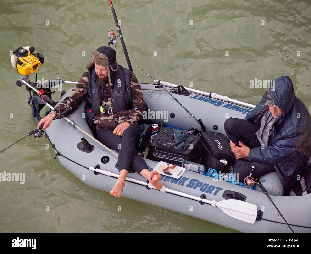 Fishing from a boat close to Brighton Pier Stock Photo Alamy