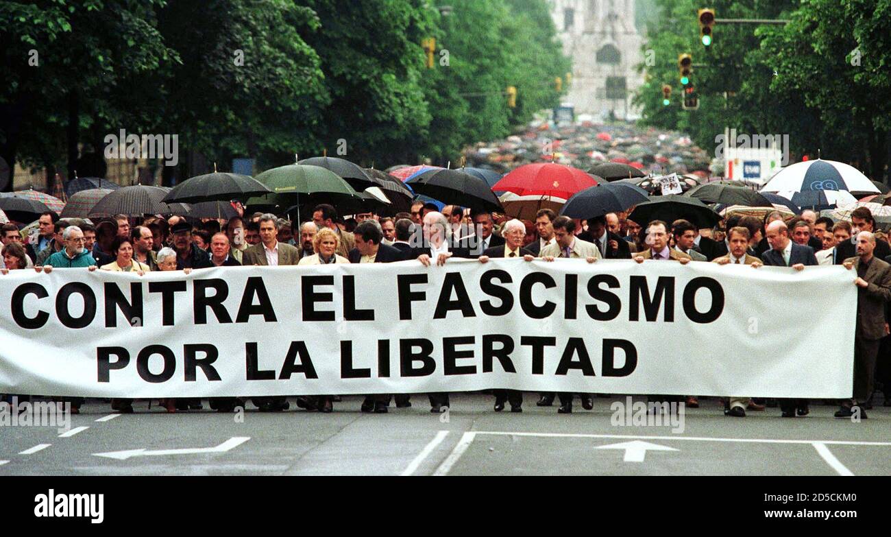 Thousands of demonstrators march through central Bilbao May 9 behind a  banner reading "Against Fascism - For Freedom" to protest against the  Basque guerrilla group ETA over the killing of a Spanish