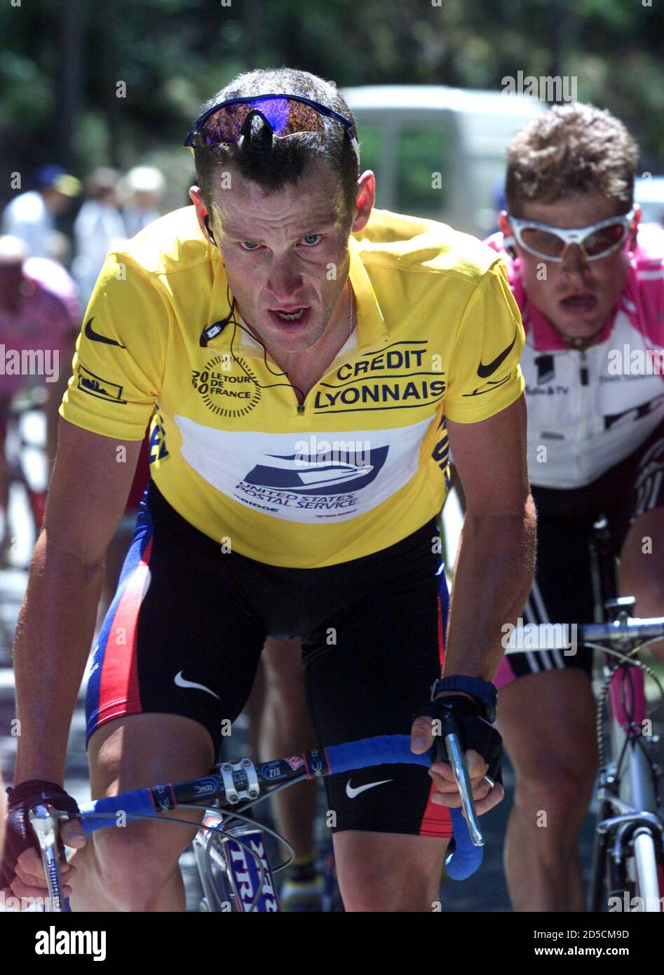 Lance Armstrong of the USA, wearing the leader's yellow jersery, grimaces  as he climbs the Mont Ventoux during the 149km 12th stage of the Tour de  France cycling race from Carpentras to