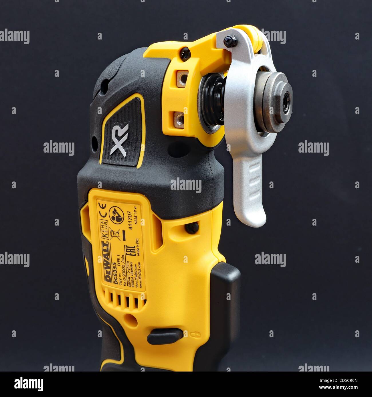 OTTERY ST MARY, DEVON - FEBRUARY 6TH 2020: Dewalt Cordless Multi Tool  stands upright on its battery on a black background Stock Photo - Alamy