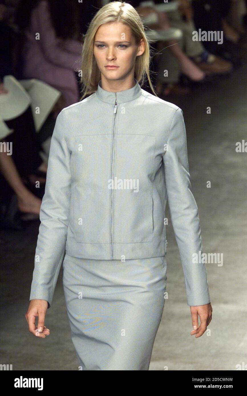 A model for designer Calvin Klein wears a light blue box cut zipper leather  jacket and matching skirt from the Calvin Klein Spring 2000 Collection  during the showing of the Collection in
