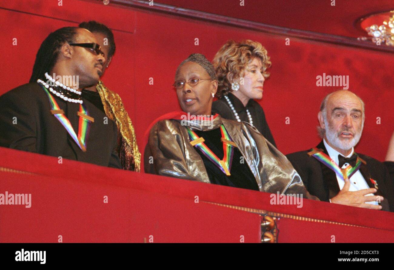 Singer and songwriter Stevie Wonder (L) talks with dancer and teacher