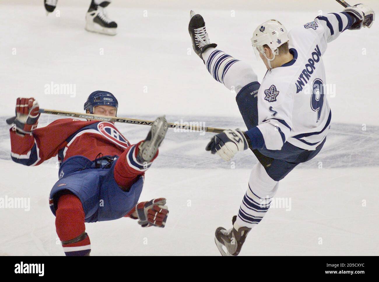 Toronto Maple Leafs center Nik Antropov (R) collides with Montreal  Canadiens center Patrick Poulin during first