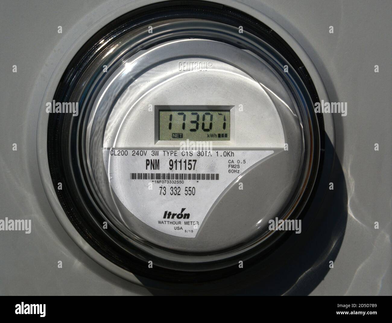 A Centron residential electric meter manufactured by Itron on a home in Santa Fe, New Mexico USA Stock Photo