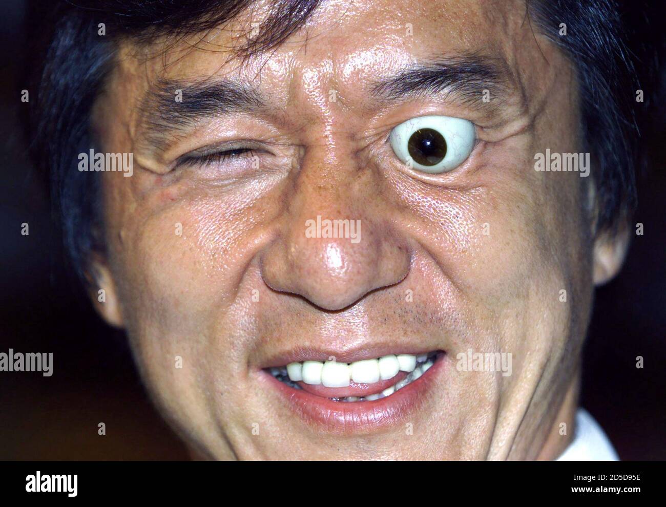 Hong Kong Gungfu Movie Star Jackie Chan Playfully Places A Fake Eyeball In The Hollow Of His Eye During A Measurements Sitting With Madame Tussaud S May 8 The Superstar S Wax Model Will
