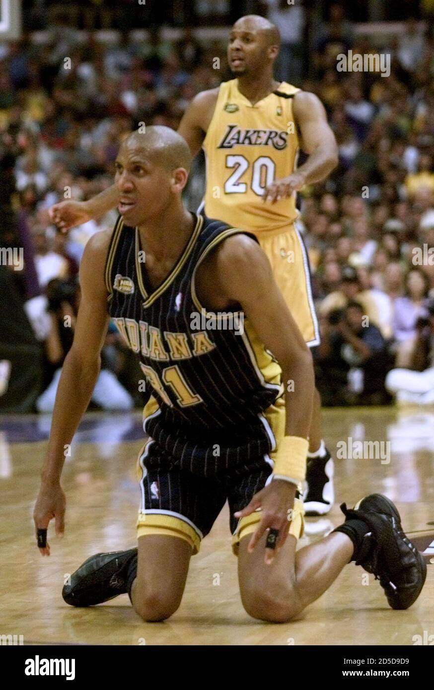 Indiana Pacers Reggie Miller Picks Himself Up Off The Floor After A Missed Shot As Los Angeles Lakers Brian Shaw Looks On During Second Half Action Of Game 2 Of The Nba