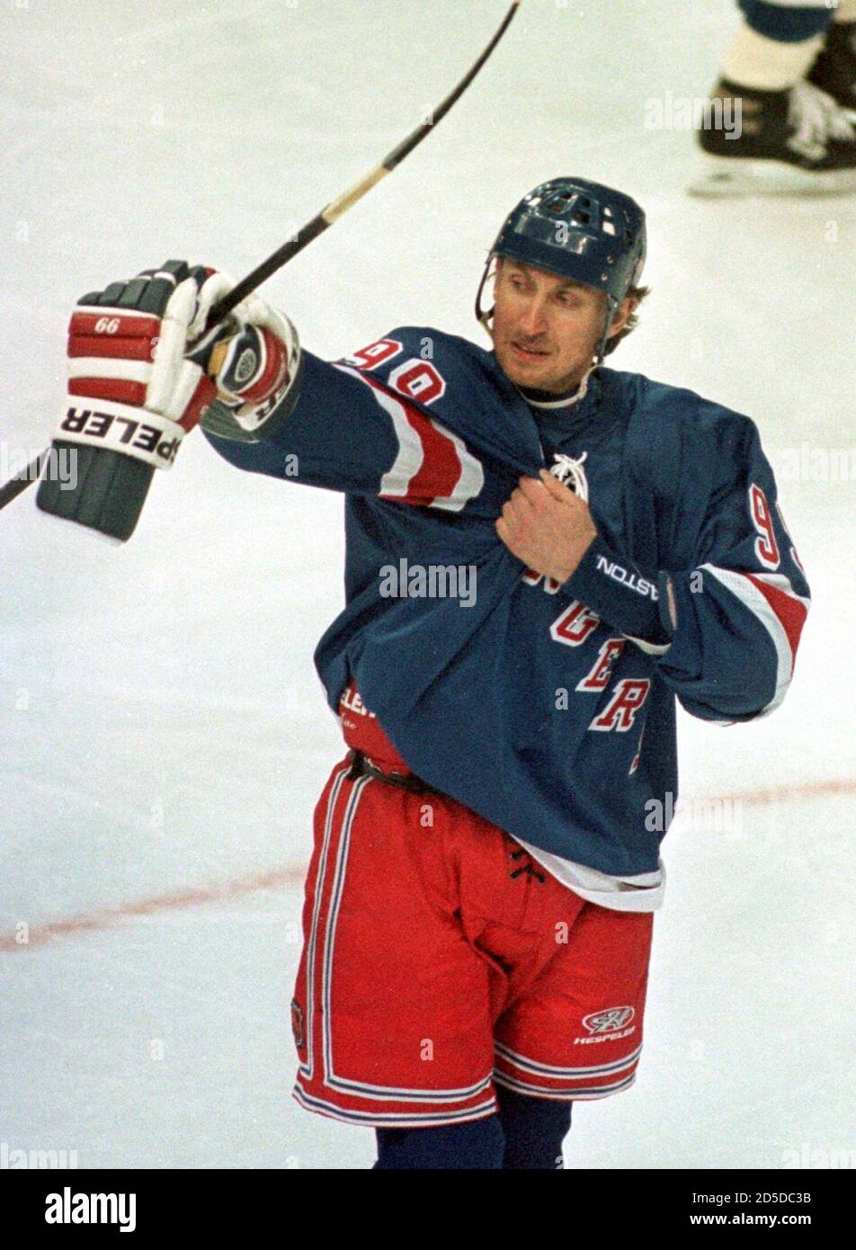 New York Rangers' Wayne Gretzky takes time to adjust his jersey during a  break in the action against the Washington Capitals at the MCI Center  January 26. Gretzky, the MVP of the