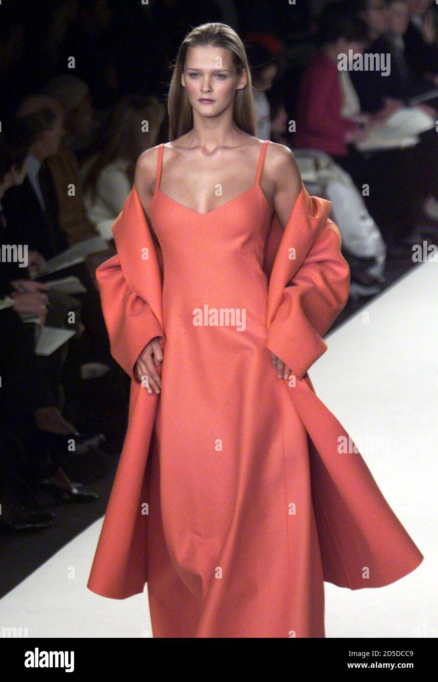 A model wears an orange felt coat over a matching gown during the Ralph  Lauren Fall/Winter 1999 fashion show in New York, February 17. Many top  fashion designers are showing their Fall/Winter
