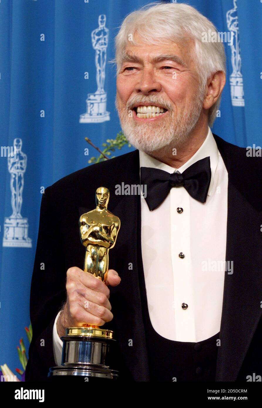 Actor James Coburn Holds His Oscar Statue After Winning Best Supporting Actor At The 71st Annual Academy Awards At The Dorothy Chandler Pavilion In Los Angeles March 21 Coburn Won The Award