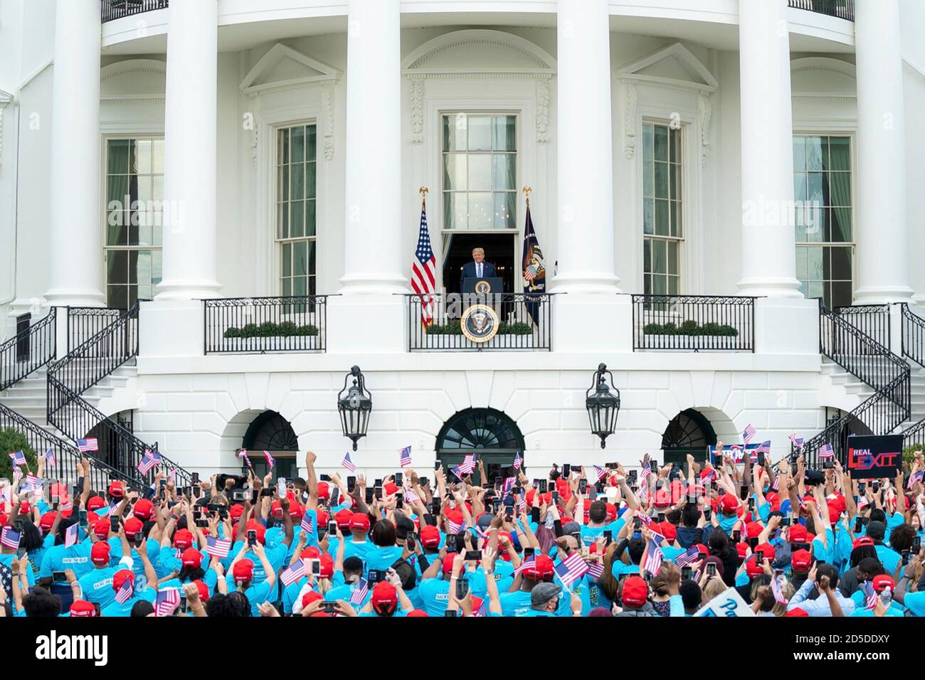 Supporter of U.S President Donald Trump, wearing red MAGA hats, cheer during a law and order themed campaign rally on the South Lawn of the White House October 10, 2020 in Washington, DC. Stock Photo